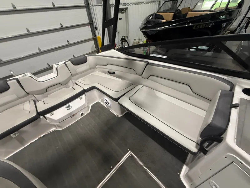Slide: The Image of Interior of a 2023 Yamaha AR190 boat with gray upholstery and modern design. - 5