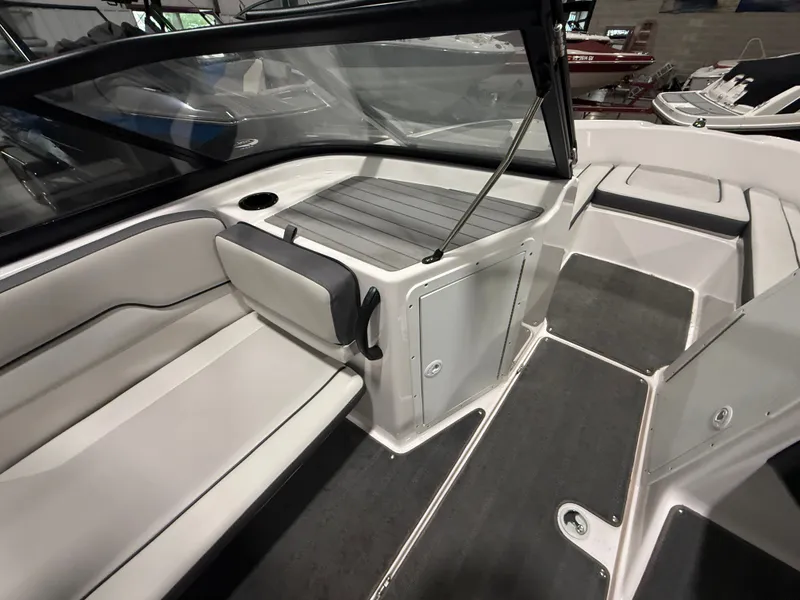 Slide: The Image of Interior view of a modern boat with gray and white seating and an open cockpit. - 12