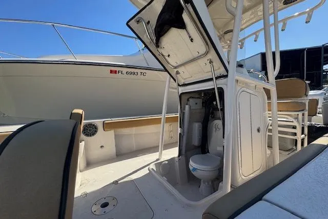 Slide: The Image of 2024 Carolina Skiff 26 Ultra Elite boat interior with open storage and seating. - 5