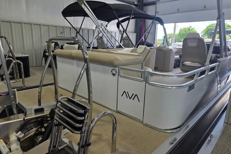 Slide: The Image of 2026 Avalon Platinum LSZ 2385 Cruise pontoon boat in showroom, featuring sleek design and comfortable seating. - 3
