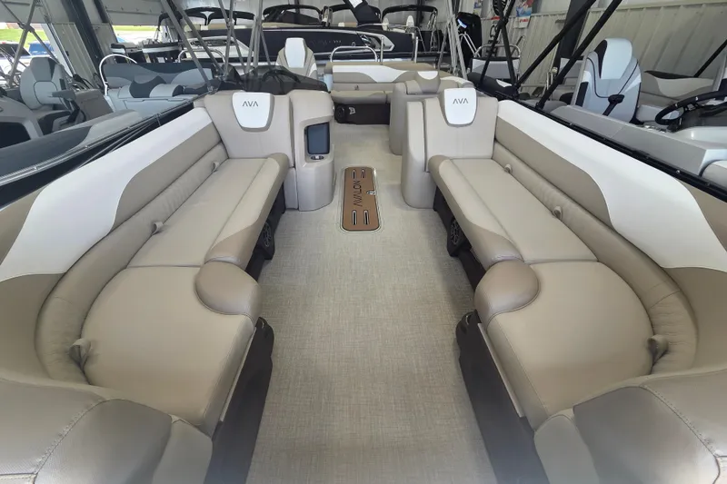 Slide: The Image of Luxurious interior of 2026 Avalon Platinum LSZ 2385 Cruise pontoon boat with beige seating. - 4