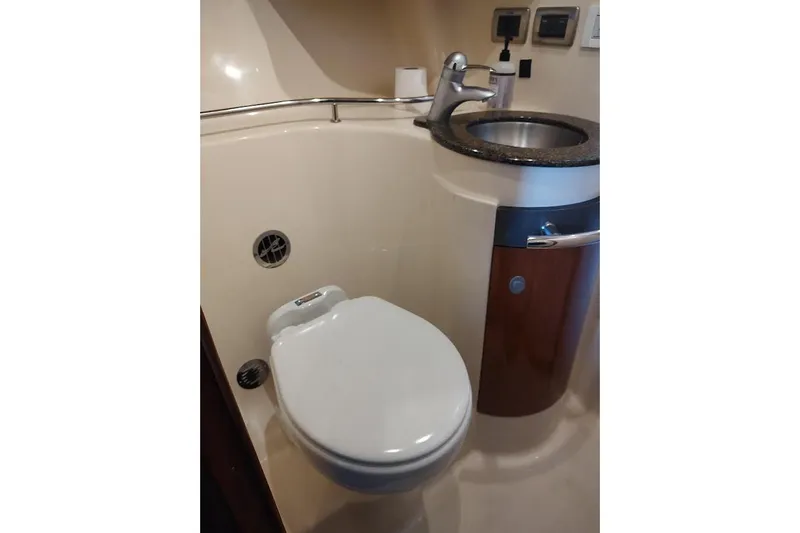 Slide: The Image of Bathroom interior of 2005 Sea Ray 390 Sundancer yacht, featuring toilet and sink. - 10
