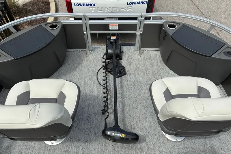 Slide: The Image of 2026 Sun Tracker Bass Buggy 18 DLX interior with seating and fishing equipment. - 12