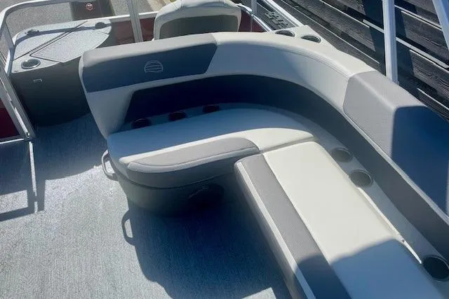 Slide: The Image of 2026 Sun Tracker Bass Buggy 18 DLX pontoon boat interior with cushioned seating. - 3