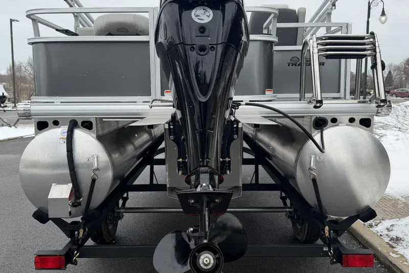 Slide: The Image of Rear view of 2026 Sun Tracker Bass Buggy 18 DLX pontoon boat with motor and ladder. - 4