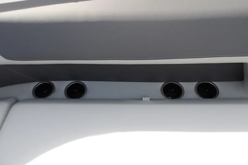 Slide: The Image of Interior of 2026 Sun Tracker Bass Buggy 18 DLX with cup holders and seating. - 14