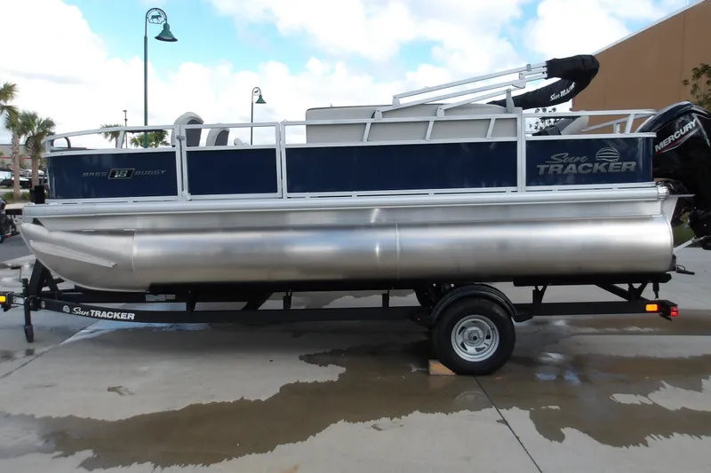 The Image of 2026 Sun Tracker Bass Buggy 18 DLX pontoon boat on trailer, side view. - 1