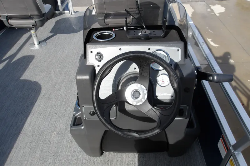 Slide: The Image of Steering console of 2026 Sun Tracker Bass Buggy 18 DLX pontoon boat. - 18