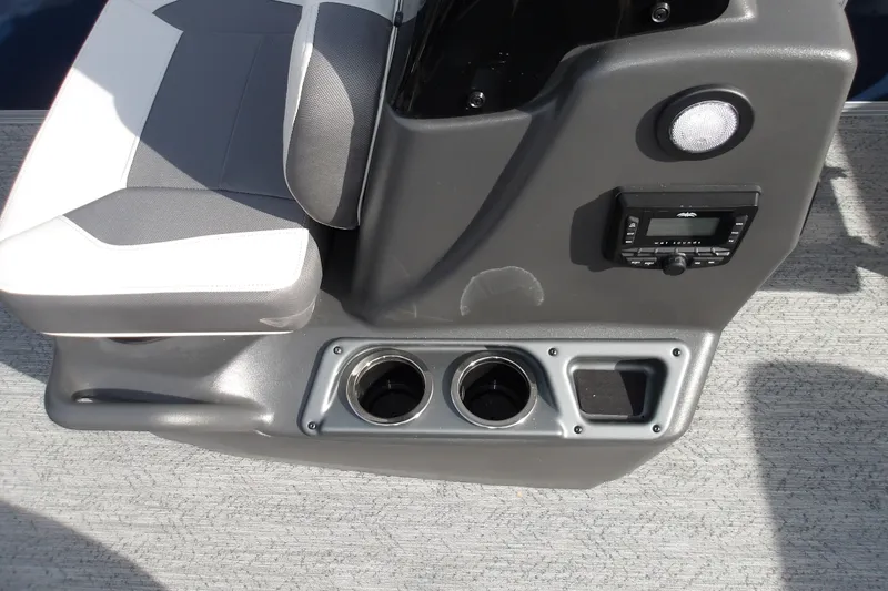 Slide: The Image of 2026 Sun Tracker Bass Buggy 18 DLX boat console with cup holders and control panel. - 19