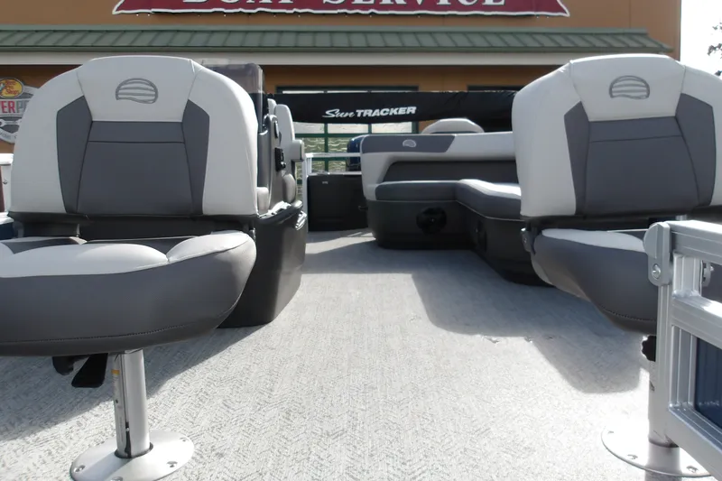 Slide: The Image of 2026 Sun Tracker Bass Buggy 18 DLX pontoon boat interior with seating. - 21