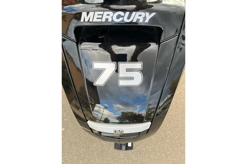 Slide: The Image of Mercury 75 horsepower outboard motor on Sun Tracker Bass Buggy 18 DLX, 2026 model. - 2