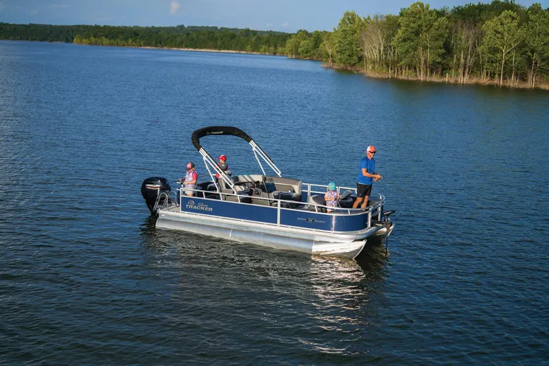 Slide: The Image of 2026 Sun Tracker Bass Buggy 18 DLX pontoon boat outside Pro Shops Outdoor World. - 5