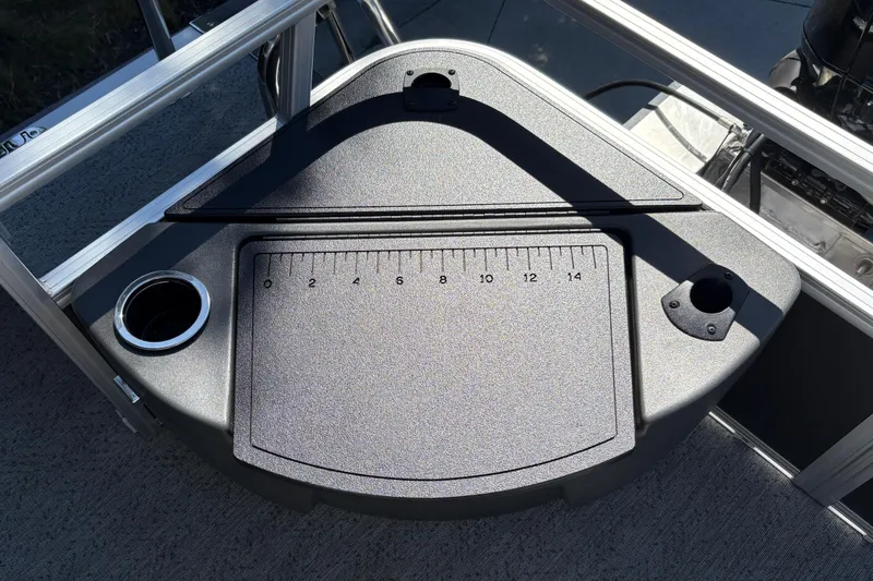 Slide: The Image of Fishing station on 2026 Sun Tracker Bass Buggy 18 DLX with ruler and cup holder. - 30