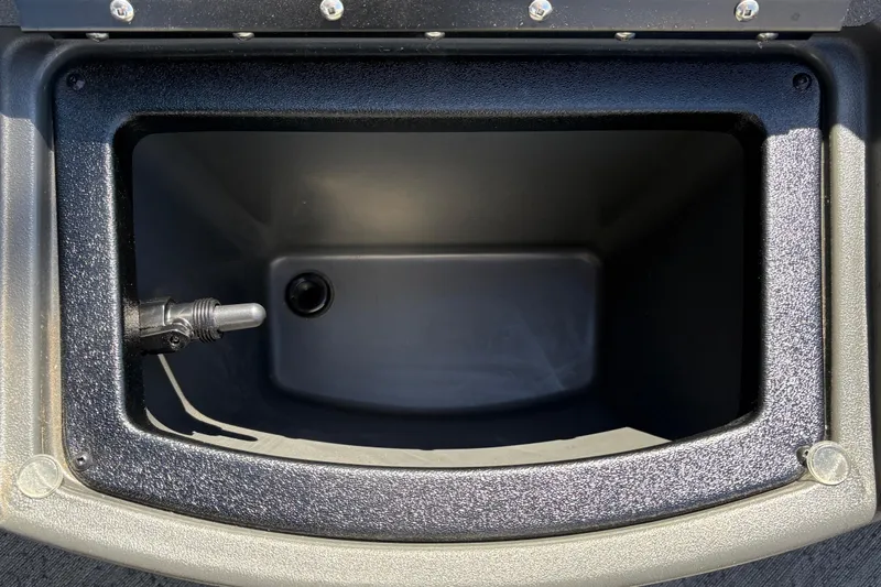 Slide: The Image of Storage compartment of 2026 Sun Tracker Bass Buggy 18 DLX boat, featuring durable interior. - 28
