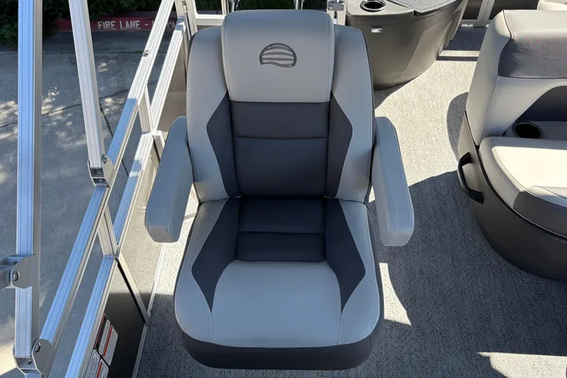 Slide: The Image of 2026 Sun Tracker Bass Buggy 18 DLX boat seat, featuring gray and black upholstery. - 21