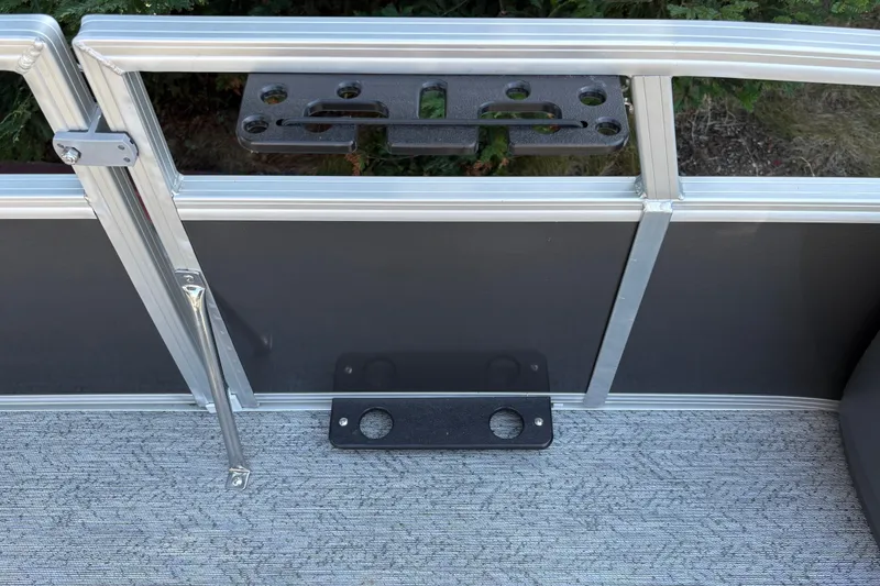 Slide: The Image of 2026 Sun Tracker Bass Buggy 18 DLX pontoon boat interior detail with rod holder. - 40