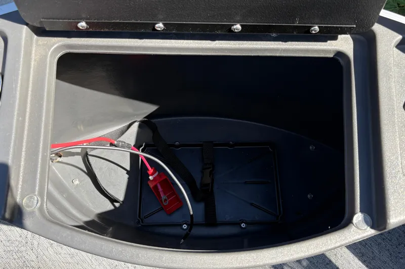 Slide: The Image of Open storage compartment in 2026 Sun Tracker Bass Buggy 18 DLX boat. - 33
