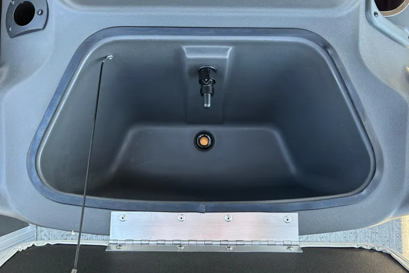 Slide: The Image of Storage compartment of 2026 Sun Tracker Bass Buggy 18 DLX boat, featuring durable construction. - 22