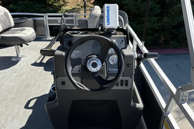Slide: The Image of 2026 Sun Tracker Bass Buggy 18 DLX steering console with Lowrance navigation system. - 19