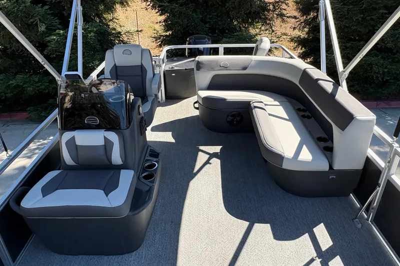 Slide: The Image of 2026 Sun Tracker Bass Buggy 18 DLX pontoon boat interior with spacious seating and modern design. - 25