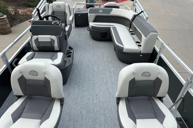 Slide: The Image of 2026 Sun Tracker Bass Buggy 18 DLX pontoon boat interior with gray and white seating. - 4