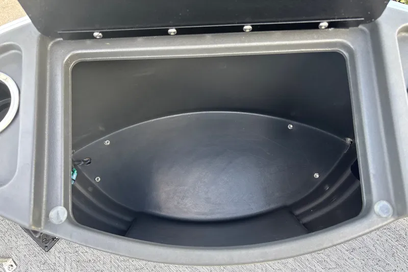 Slide: The Image of Open storage compartment on 2026 Sun Tracker Bass Buggy 18 DLX boat. - 26
