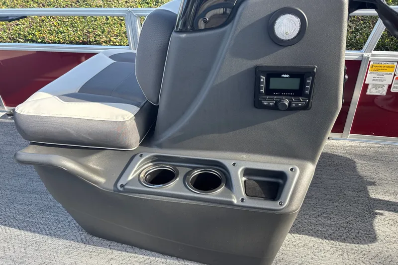 Slide: The Image of 2026 Sun Tracker Bass Buggy 18 DLX console with cup holders and audio system. - 20