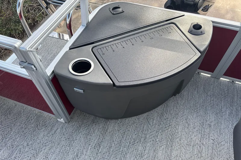 Slide: The Image of 2026 Sun Tracker Bass Buggy 18 DLX boat with integrated storage and cup holder. - 23