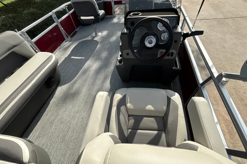 Slide: The Image of 2026 Sun Tracker Bass Buggy 18 DLX interior with steering console and seating. - 16