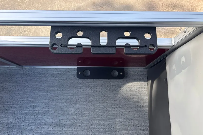 Slide: The Image of 2026 Sun Tracker Bass Buggy 18 DLX boat interior with metal bracket detail. - 36