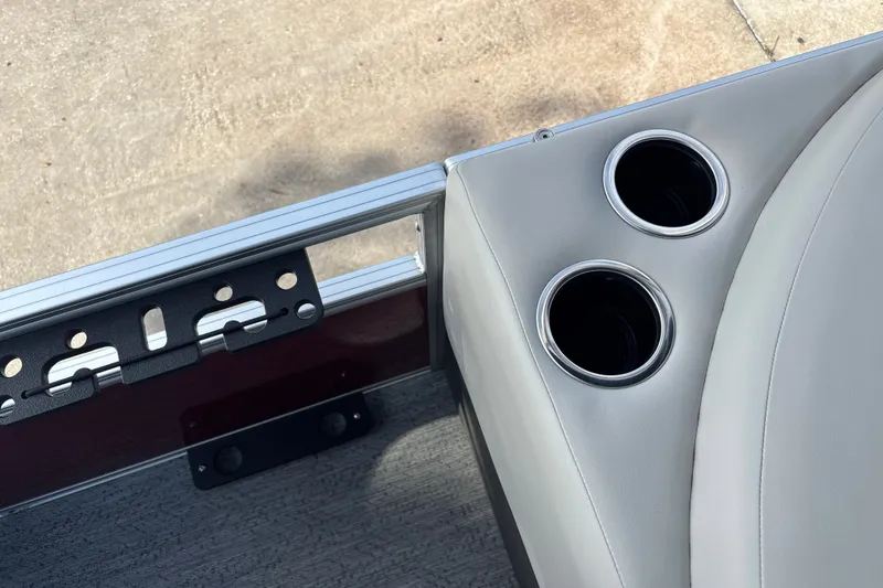 Slide: The Image of 2026 Sun Tracker Bass Buggy 18 DLX boat interior with dual cup holders. - 35