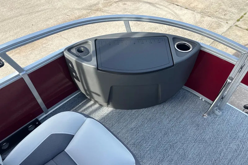 Slide: The Image of 2026 Sun Tracker Bass Buggy 18 DLX pontoon boat interior with seating and console. - 33