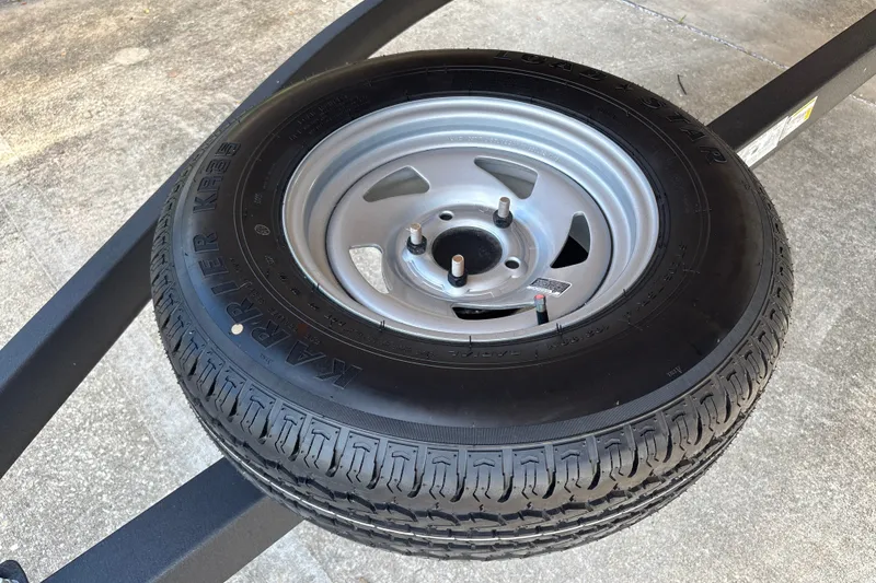 Slide: The Image of Spare tire on Sun Tracker Bass Buggy 18 DLX trailer, 2026 model. - 42
