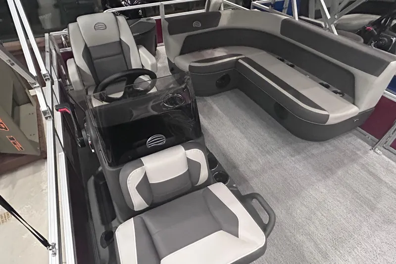 Slide: The Image of 2026 Sun Tracker Bass Buggy 18 DLX interior with modern seating and steering console. - 10