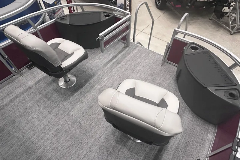 Slide: The Image of 2026 Sun Tracker Bass Buggy 18 DLX interior with two swivel seats and storage compartments. - 11