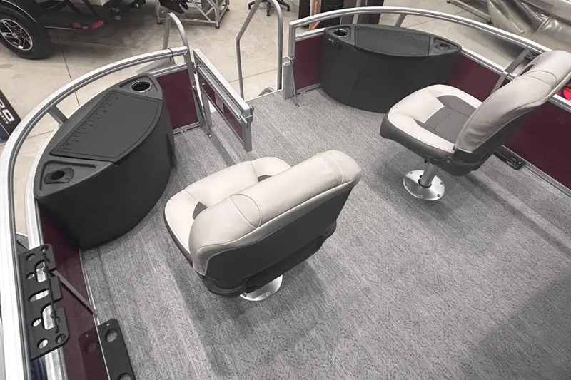 Slide: The Image of 2026 Sun Tracker Bass Buggy 18 DLX interior with swivel seats and storage compartments. - 12