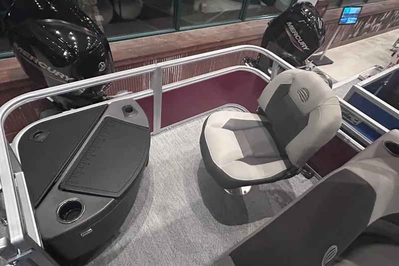 Slide: The Image of 2026 Sun Tracker Bass Buggy 18 DLX interior with seating and fishing station. - 16