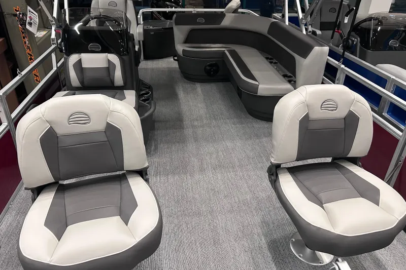 Slide: The Image of 2026 Sun Tracker Bass Buggy 18 DLX interior with gray seating and spacious layout. - 8