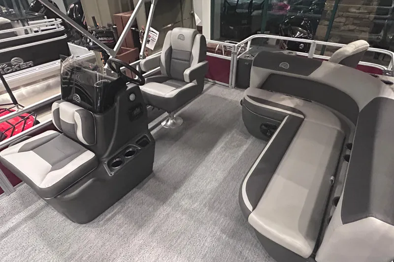 Slide: The Image of 2026 Sun Tracker Bass Buggy 18 DLX interior with seating and steering console. - 9