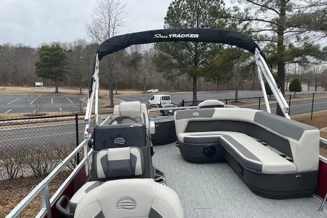 Slide: The Image of 2026 Sun Tracker Bass Buggy 18 DLX pontoon boat with spacious seating and canopy. - 80