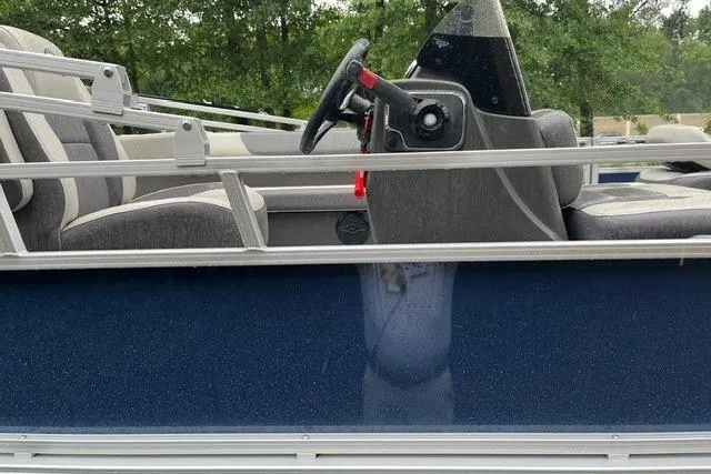 Slide: The Image of 2026 Sun Tracker Bass Buggy 18 DLX pontoon boat with steering console and seating. - 8