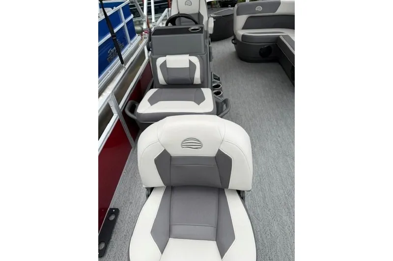 Slide: The Image of 2026 Sun Tracker Bass Buggy 18 DLX interior with gray and white seating. - 7