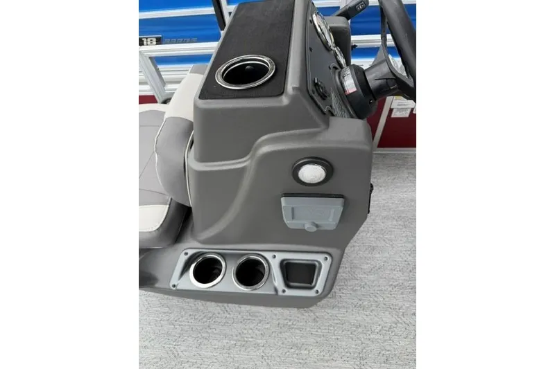 Slide: The Image of 2026 Sun Tracker Bass Buggy 18 DLX console with cup holders and steering wheel. - 8