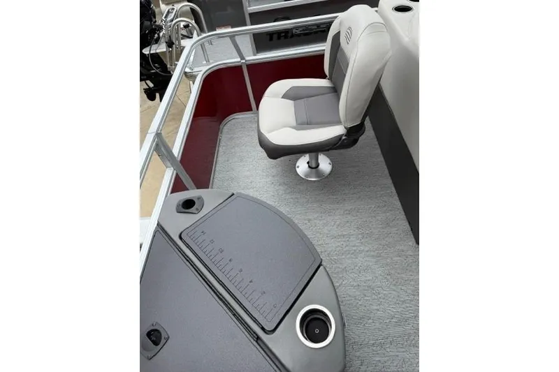 Slide: The Image of 2026 Sun Tracker Bass Buggy 18 DLX boat interior with swivel seat and fishing station. - 9