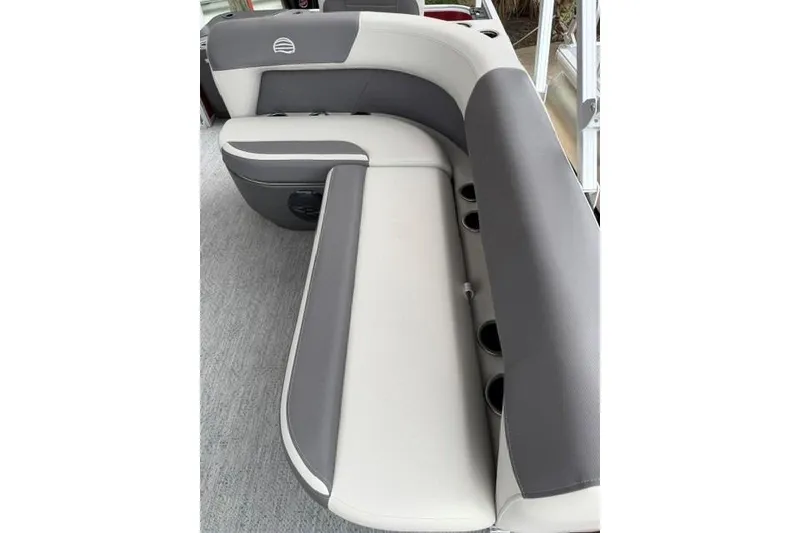 Slide: The Image of 2026 Sun Tracker Bass Buggy 18 DLX boat seating with gray and white upholstery. - 15