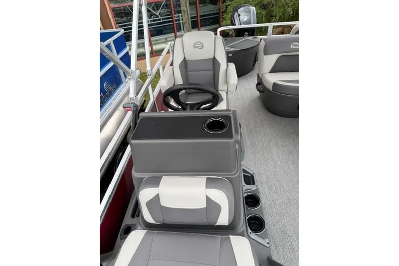 Slide: The Image of 2026 Sun Tracker Bass Buggy 18 DLX interior with steering wheel and seating. - 6