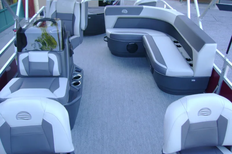 Slide: The Image of 2026 Sun Tracker Bass Buggy 18 DLX interior with gray seating and modern design. - 5