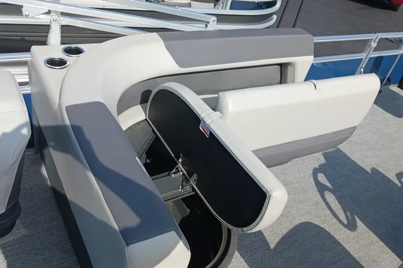 Slide: The Image of 2026 Sun Tracker Bass Buggy 18 DLX boat seat with storage compartment open. - 16
