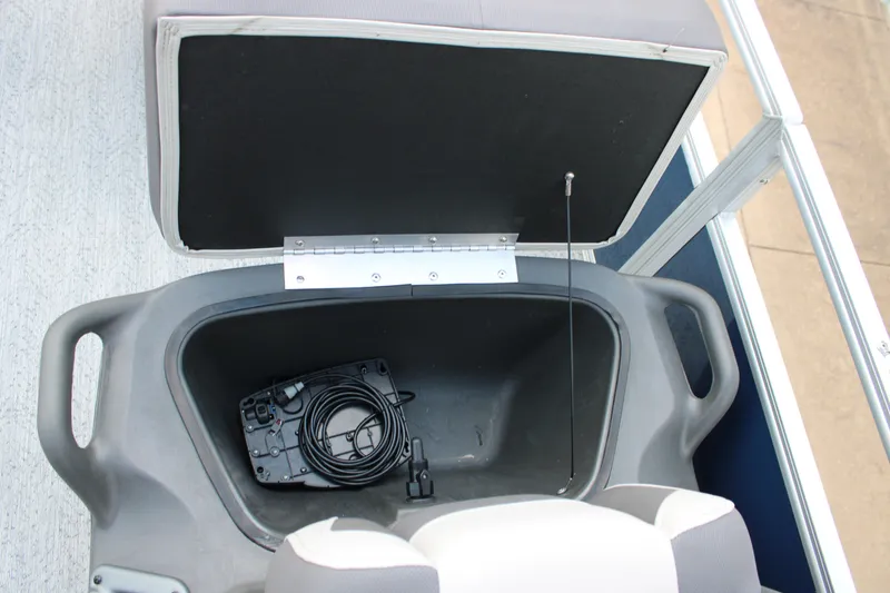 Slide: The Image of Open storage compartment in 2026 Sun Tracker Bass Buggy 18 DLX pontoon boat. - 7