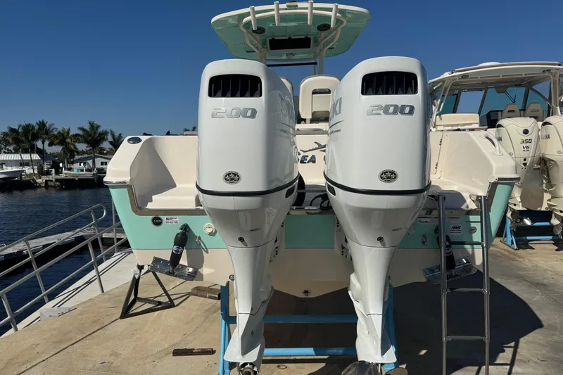 Slide: The Image of Close-up of a 2023 Sea Chaser 27 HFC CC boat component with Suzuki label. - 16